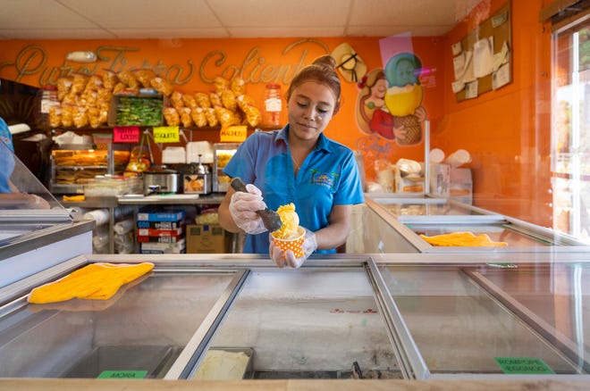 Maria Dominguez scoops ice cream at Paleteria Tierra Caliente, located at 3182 SE Dixie Highway in Stuart. The shop serves up a variety of cool treats including popsicles, aqua frescas, mangonadas and ice creams. Their items are all made in-house.