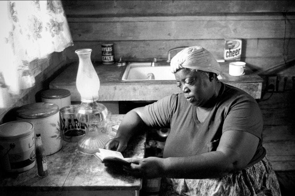 Ten years after "Harvest of Shame," The Palm Beach Post won a Pulitzer Prize for photography for its series, "Migration to Misery," about farmworkers who migrated from the Glades to North Carolina. Here, migrant worker Lillie Mae Brown reads the Bible in her 10-by-10 foot shack in South Bay.