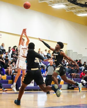 Fort Pierce Central's Christian Maxon (11) makes a 3-point basket against Treasure Coast in a high school boys basketball game on Tuesday, Dec. 14, 2021, at Fort Pierce Central High School. Fort Pierce Central won 59-52.