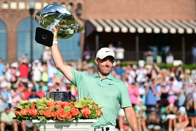 Aug 28, 2022; Atlanta, Georgia, USA; Rory McIlroy holds up the FedEx Cup trophy after winning the TOUR Championship golf tournament. Mandatory Credit: Adam Hagy-USA TODAY Sports