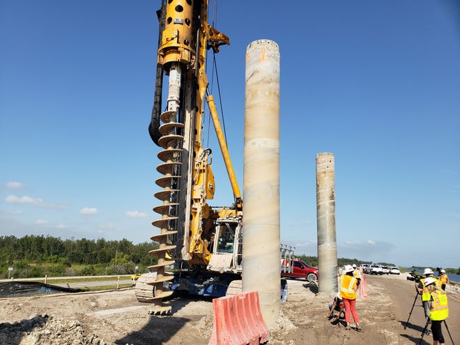 A gigantic drill bit is used by Bauer Foundation Corp., contractors constructing the cut-off wall inside the Herbert Hoover Dike at Lake Okeechobee on April 14, 2021.
