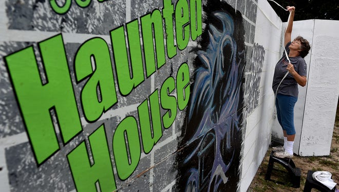 "It's usually pretty fun, unless you get rained on," said Shirley Wolstenholme, of Sebastian, while painting the outside walls of the Sebastian River Junior Woman's Club's 36th annual Haunted House, Terror on Main Street, on Monday, Oct. 3, 2016, at 1036 Main St. in Sebastian. The haunted house will be open for tours 7:30 p.m. to 11 p.m. Oct. 14, 15, 21, 22 and 26-31. Admission is $8, or $7 with a nonperishable food item. "It's our major fundraiser," said Teddy Hulse, project chairman. "Everything we raise here goes back into the community … money to do our projects in town." For more information, go to gfwcsebastianjrs.org. To see more photos, go to TCPalm.com.