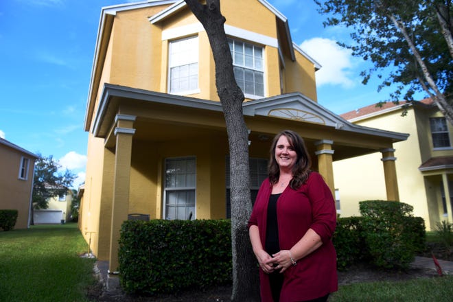 Kristen West, 48, stands in front of her Port St. Lucie home on Thursday, Sept. 30, 2021, were she and three foster children live. West is looking to adopt the three girls and another boy and is looking for a new home before the lease on her apartment expires in January. Unfortunately, West is unable to find anything in the area for less than $2,000, well out of her budget range.