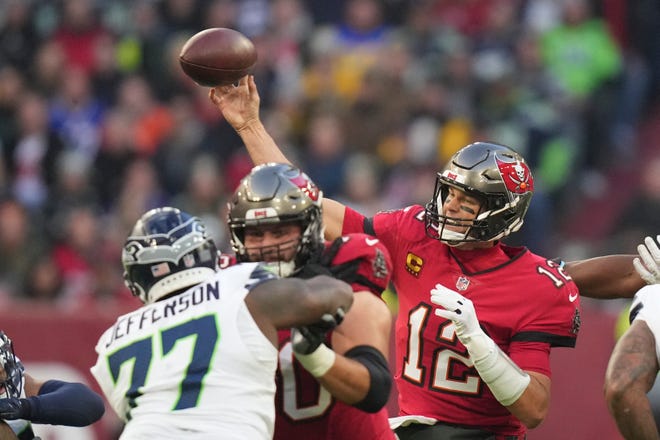Tampa Bay Buccaneers quarterback Tom Brady (12) throws during the first half of an NFL football game against the Seattle Seahawks, Sunday, Nov. 13, 2022, in Munich, Germany. (AP Photo/Matthias Schrader)