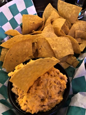 The Buffalo Chicken Dip at Tail Gators Brews & Grill is a spicy concoction of ground chicken, lots of cheese, and hot sauce served with crispy tortilla chips