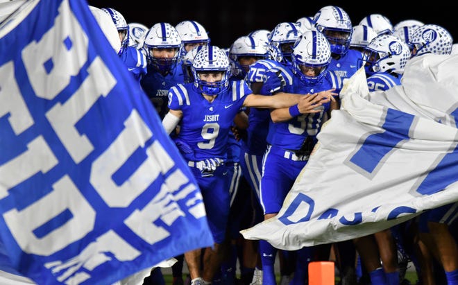 Jesuit takes the field to play Pine Forest in the Class 6A state championship game at DRV PNK Stadium, Fort Lauderdale, FL  Dec. 17, 2021.