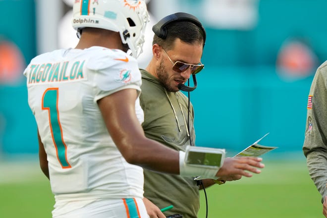 Dolphins quarterback Tua Tagovailoa talks to head coach Mike McDaniel during the second half of the win against the Cleveland Browns on Nov. 13.