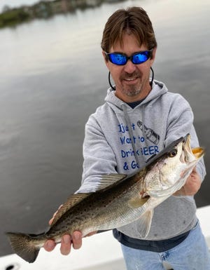 Jeff Patterson's dad, also named Jeff, with a catch-and-release trout he landed this past week.