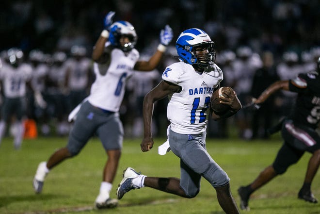 Apopka quarterback Tyson Davison (12) runs the ball in to the end zone for a touchdown during the Class 4M state semi-final between host Palm Beach Central and Apopka on Friday, December 2, 2022, in Wellington, FL. Final score, Apopka, 27, Palm Beach Central, 24.