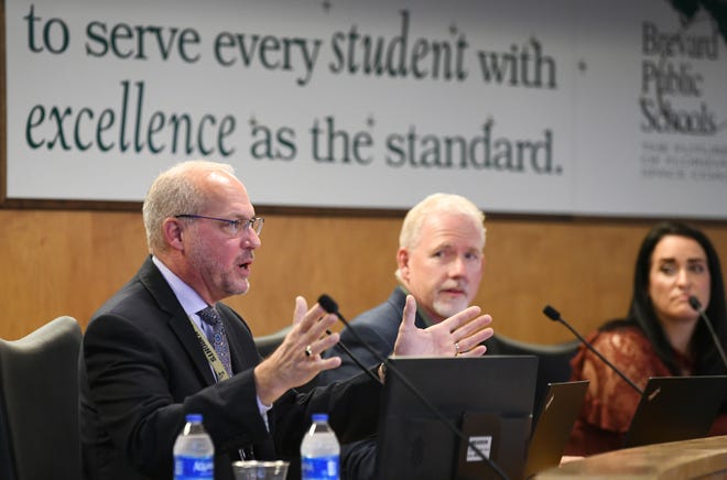 Superintendent Mark Mullins, seen at left,  and the Brevard County school district held a Monday morning meeting regarding a mutual separation agreement, finalizing his departure from BPS. The meeting included public comments, and statements by school board members. Also in this photo is new members of the school board,  Gene Trent and Megan Wright.