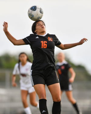 Lincoln Park Academy's Isabella Saenz-Pazmino heads the ball during a high school girls soccer match against South Fork on Tuesday, Dec. 13, 2022, in Fort Pierce.