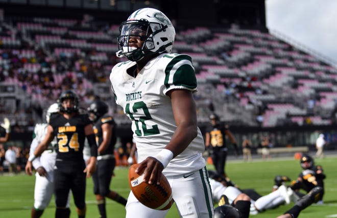 Keyone Jenkins (12) of Miami Central scores a touchdown against Merritt Island during the Class 5A state championship game at DRV PNK Stadium, Fort Lauderdale, FL  Dec. 17, 2021.