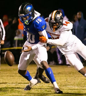 Hawthorne Hornets Jailen Ruth (14) strips the ball from Wildwood Wildcats quarterback Jamari Dickens (10) causing a fumble. Hawthorne recovered. Hawthorne Hornets took on the Wildwood Wildcats in 1R Regional Semifinal at Hawthorne High School in Hawthorne, FL on Friday, November 18, 2022. Hawthorne won 33-15.  [Doug Engle/Ocala Star Banner]