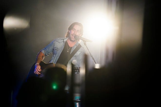 Jake Owen performs for the crowd during his annual hometown concert benefiting the Jake Owen Foundation Saturday, Oct. 9, 2021, at the Corporate Air Hanger at the Vero Beach Regional Airport.