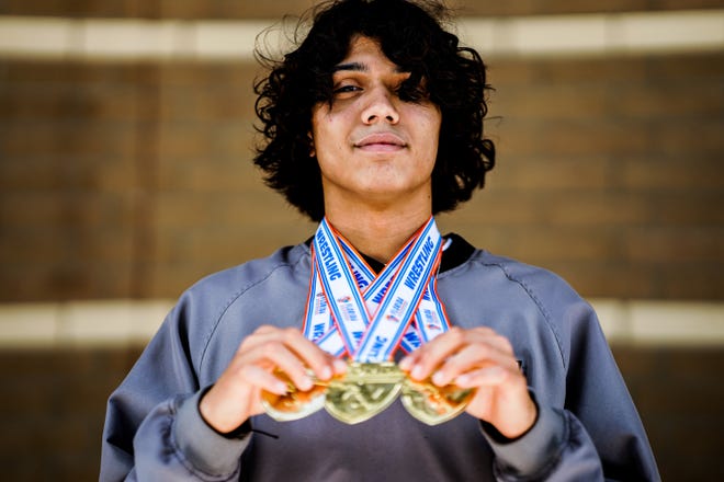 Jensen Beach High School junior Jewell Williams holds his medals during a homecoming celebration Monday, March 7, 2022, at Jensen Beach High School. A school record was broken with nine Jensen Beach wrestlers reaching the podium to win the FHSAA State Wrestling Championship, held in Kissimmee.