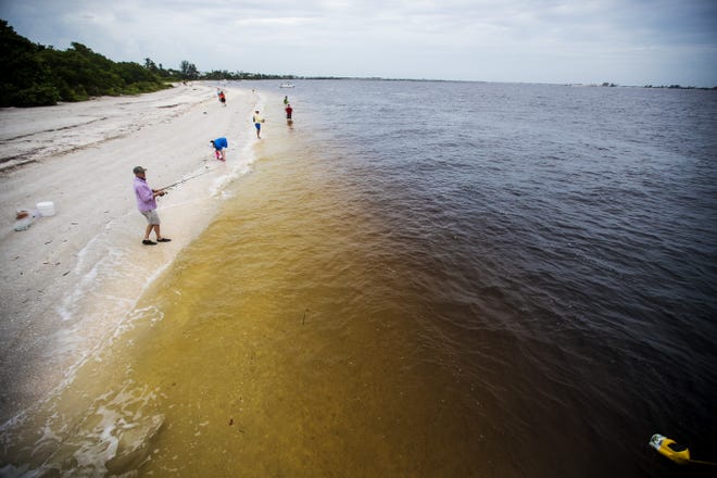 Anglers fish near the Sanibel Lighthouse during the fall of 2020. The Army Corps of Engineers says the structures that holds back Lake Okeechobee waters is safe and structurally sound after two hurricanes this past season.