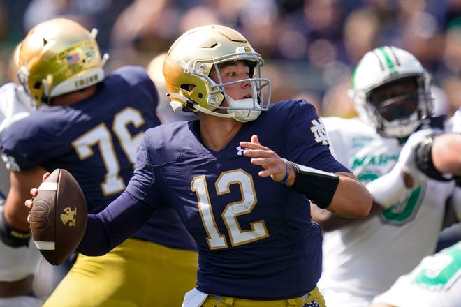 Notre Dame quarterback Tyler Buchner (12) throws against Marshall during the first half of their game in South Bend, Ind., on Sept. 10.