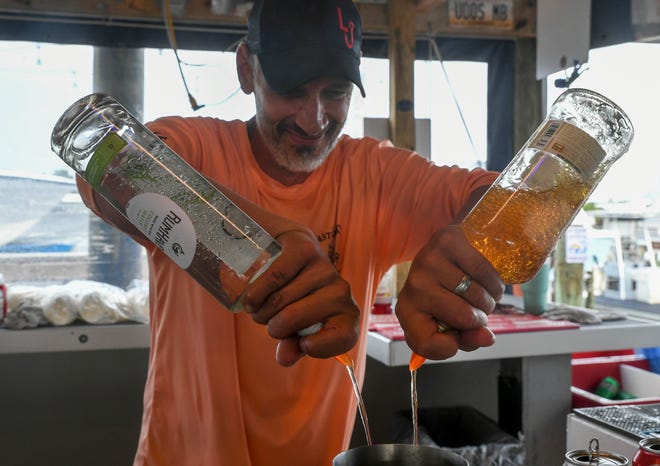 Bartender Shane Avery creates a drink for a customer at Little Jim Bait & Tackle on Tuesday, Nov. 22, 2022, in Fort Pierce. "The view, the atmosphere, the drinks, the service, the employees, everything. We have it all," Avery said.