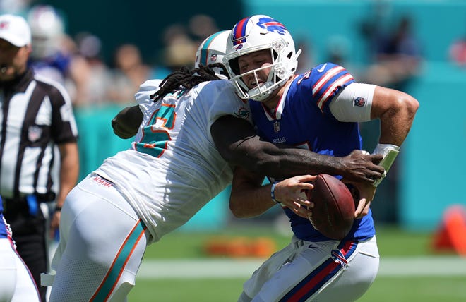 Dolphins outside linebacker Melvin Ingram sacks Bills quarterback Josh Allen during their first meeting this season in September.