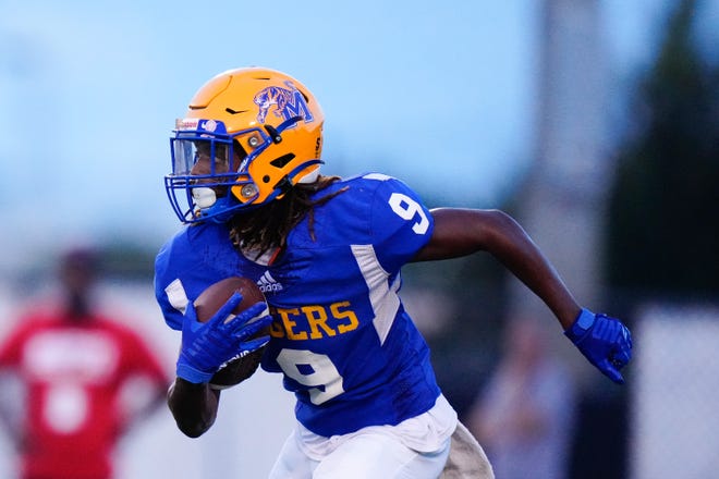 Martin County High School’s wide receiver Ricardo Weaver (9) runs the ball against Wellington in a high school football game on Friday, Sept. 2, 2022 at Martin County High School. Martin County High School won 42-7.
