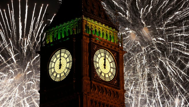 Fireworks explode over the clock known as Big Ben, housed in Elizabeth Tower, to celebrate the New Year in London, Jan. 1, 2015. You can celebrate like a Brit on Saturday at Summer Crush Winery in Fort Pierce.
