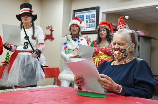 "It's very nice of them; it's the first time I've seen Santa Claus on a motorcycle," said resident Marynoel Turner, 69, who sings Christmas carols with the Wildflower Lady Riders on Saturday, Dec. 17, 2022, at Martin Coast Center for Rehabilitation and Healthcare in Hobe Sound. Founder Jennifer Vanhohenstein, 56, of Hobe Sound, said she started the Wildflower Lady Riders in 2017 after seeing a need for women motorcycle riders to have a sense of community and friendship. From September to December, the Lady Riders do back-to-back community events and ride their motorcycles to hand out care packages to people or to just make someone's day special.