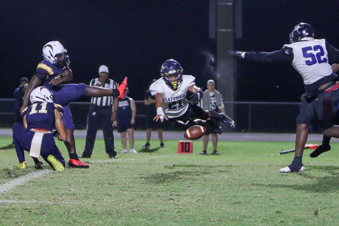 GaitherÕs Eugene Wilson flies in from the side and blocks the Lightning extra point. Action as Lehigh beat Gaither in their first round playoff game 27-0.