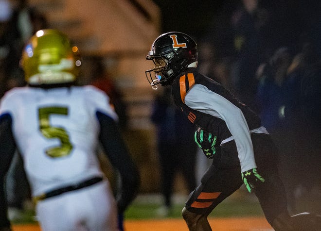 Lakeland (7) Cormani McClain runs back an interception against Osceola during first half action in Lakeland Fl  Friday December 2,2022.
Ernst Peters/The Ledger