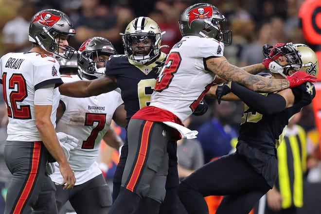 Tampa Bay Buccaneers wide receiver Mike Evans (13) and New Orleans Saints cornerback Marshon Lattimore (23) get into an altercation during the second half Sunday.