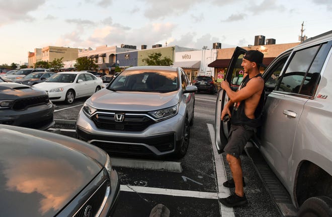 Niko Rastrelli, of Stuart, parks in a lot on Southwest Flagler Avenue on Friday, Dec. 2, 2022, in downtown Stuart. From Southwest St. Lucie Avenue to Confusion Corner, Southwest Flagler Avenue has 126 spots for parking.