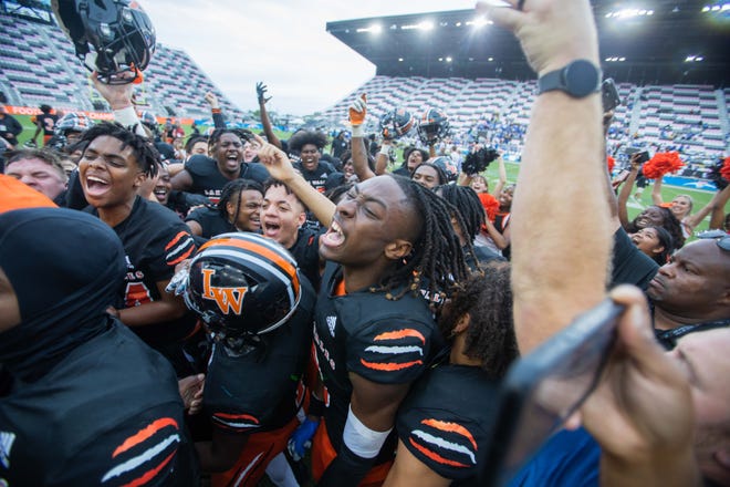 The Lake Wales Highlanders celebrate victory after the end of the second half of the Class 3S football state championship game between Lake Wales and Mainland at DRV PNK Stadium on Friday, December 16, 2022, in Fort Lauderdale, FL. Final score, Lake Wales, 32, Mainland, 30.