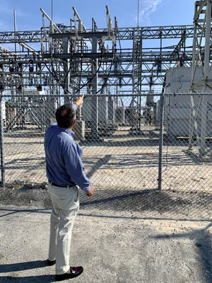 Lake Worth Beach Utilities Director Ed Liberty points to the spot at the city's main power station where a raccoon was electrocuted and caused a power outage on Saturday, Dec. 10.