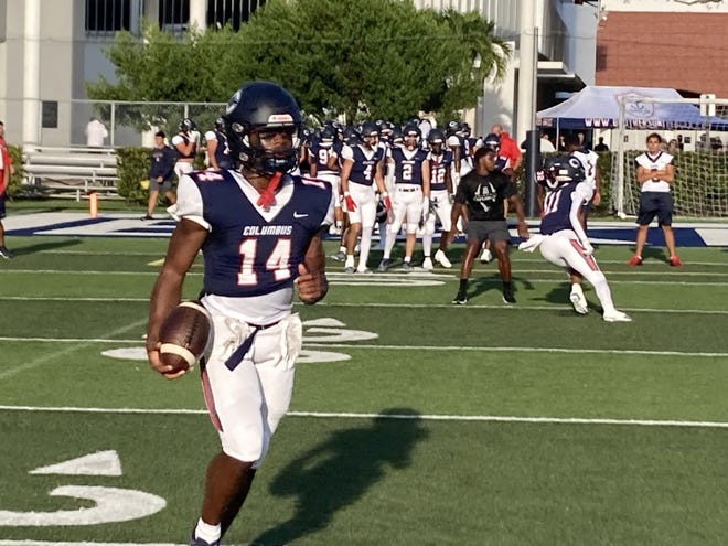 Columbus running back Sedrick Irvin Jr. warms up before playing Jesuit on Friday.