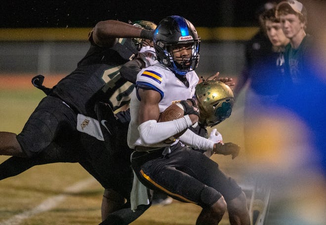John Carroll Catholic’s strong safety Robert Jones (3) gets some yards for the Rams in the second half against Trinity Catholic at Trinity Catholic in Ocala, FL on Friday, December 2, 2022. The Celtics won 22-10 and now advance to the State Championship. [Cyndi Chambers/Ocala Star Banner]  2022