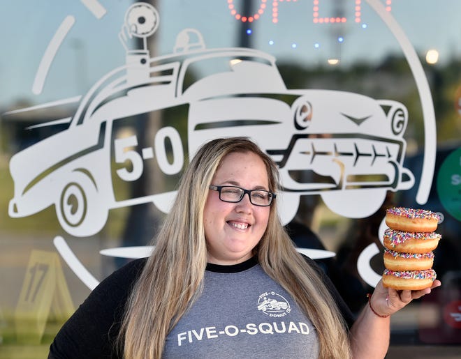 Five-O Donut Co. founder and CEO Christine Nordstrom appears outside the doughnut shop's original Ringling Boulevard location in Sarasota.