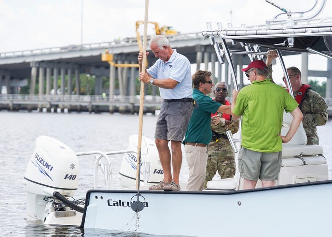 Indian Riverkeeper Jim Moir (left) takes a sample of the sediment on the floor of the St. Lucie River while taking a tour with Gen. Jason Kelly, of the U.S. Army Corps of Engineers South Atlantic Division, Col. James Booth, of the Jacksonville District, Stuart Mayor Merritt Matheson, environmental groups and county representatives Thursday, June 9, 2022, in Martin County. "The main reason for this is to get the Army Corps out on the water," said Matheson. "Showing someone physically what they are trying to fix, what they're striving to keep, improve or showing them the problems that have occurred has a real impact."