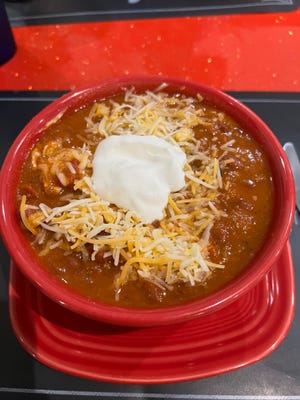 A crock of housemade chili at South Florida Restaurant and Bar is chock full of ground beef, beans, and aromatic chili seasonings.