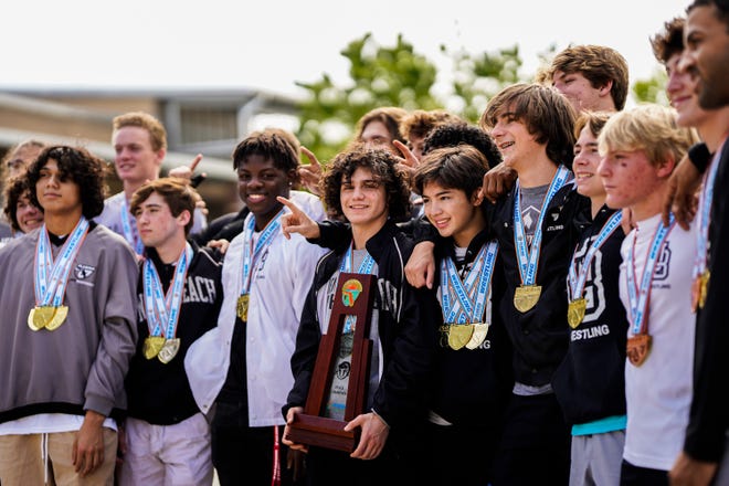 Jensen Beach High School wrestlers attend a homecoming celebration Monday, March 7, 2022, at Jensen Beach High School. A school record was broken with nine Jensen Beach wrestlers reaching the podium to win the FHSAA State Wrestling Championship, held in Kissimmee.