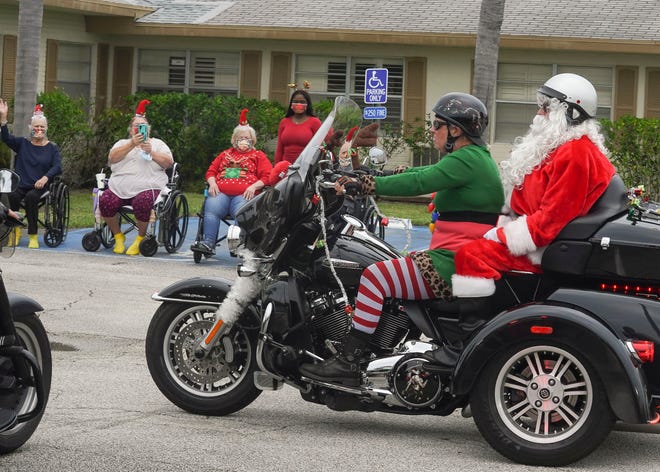 The Wildflower Lady Riders visit residents at Martin Coast Center for Rehabilitation and Healthcare giving gifts, singing carols and spreading holiday cheer, Saturday, Dec. 17, 2022, in Hobe Sound. Founder Jennifer Vanhohenstein, 56, of Hobe Sound, said she started the Wildflower Lady Riders in 2017 after seeing a need for women riders to have a sense of community and friendship. From September to December, the Lady Riders do back-to-back community events and ride their motorcycles to hand out care packages to people or to just make someone's day special.