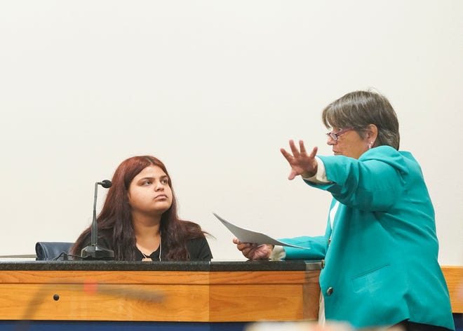 Assistant State Attorney Nita Denton (right) shows evidence to state witness Jessica Rosado, 19, the daughter of victim Maribel Morales-Rosado, during the murder trial of Donald "Hondo" Williams III, 30, in Circuit Judge Sherwood Bauer's courtroom, Tuesday, Dec. 6, 2022, at the Martin County Courthouse in Stuart. Williams III is accused of fatally shooting his estranged girlfriend, Morales-Rosado, at her home in Indiantown on Tuesday, Aug. 11, 2020, as her six children watched. Williams III is charged with first-degree murder, two counts of aggravated assault with a deadly weapon, one count of burglary to a dwelling with an assault or battery while armed, discharge of a firearm causing death, and one count of possession of a firearm by a prohibited person.