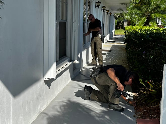 Martin County Sheriff's investigators on Dec. 5, 2022, re-examine the scene where Henry and Ginger Wallace were fatally shot two days earlier.