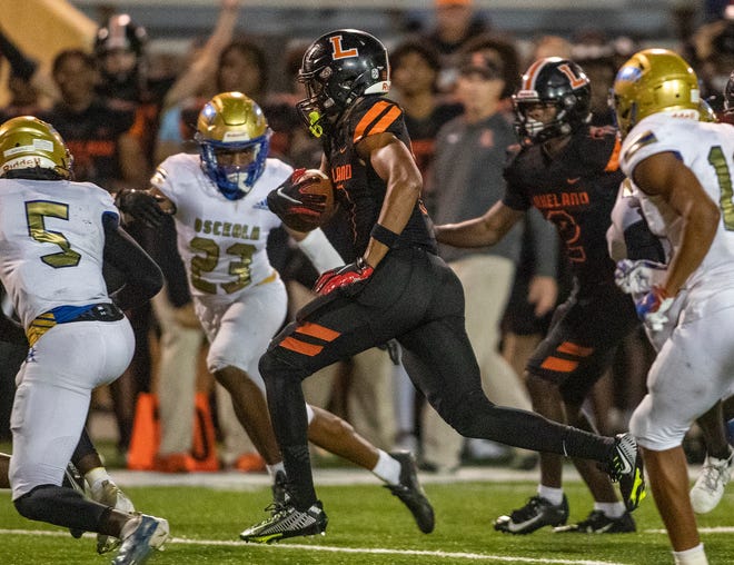 Lakeland (10) Tyler Williams runs through the Osceola defense during first half action in Lakeland Fl  Friday December 2,2022.
Ernst Peters/The Ledger