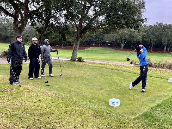 Duke Butler IV tees off No. 9 of the Sea Island Club Seaside Course on Tuesday, during the second round of the Henry Tuten Gator Bowl Pro-Am. Watching are team members (from the left) Scott Dellorso, Colin Monagle and Will Sprague.