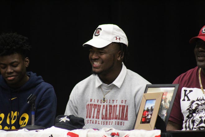 Jackson linebacker Grayson Howard is all smiles during his signing day ceremony. He's headed for South Carolina.