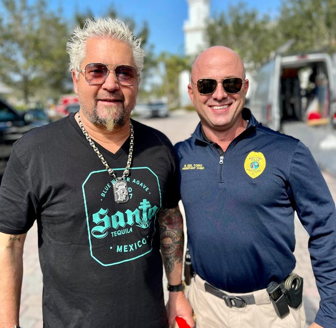 Guy Fieri stands next to PSLPD Assistant Chief Richard Del Toro in Tradition.