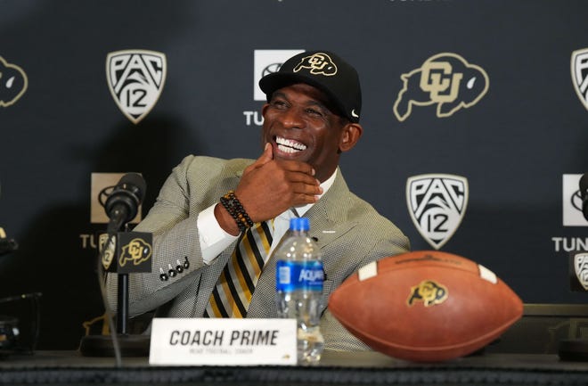 Dec 4, 2022; Boulder, CO, USA; Colorado Buffaloes head coach Deion Sanders reacts during a press conference at the Arrow Touchdown Club.