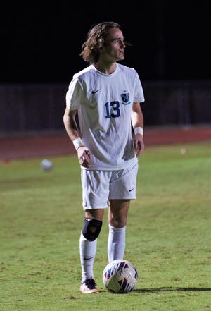 Jensen Beach junior Gavin Harte lines up a free kick during a high school soccer match against Sebastian River on Monday, Jan. 9, 2022 in Sebastian. Harte netted a hat trick inside the first 20 minutes of the match to lead the Falcons to a 5-2 win.
