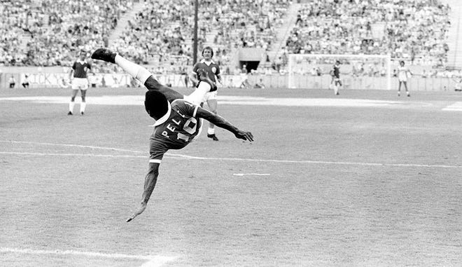 New York Cosmos star Pele flips through the air after a scissors kick during a game in Tampa against the Tampa Bay Rowdies on May 29, 1977. Photo: Jim Bourdier, AP