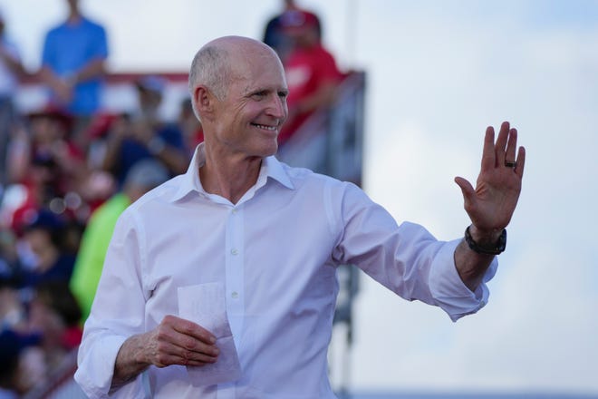 Sen. Rick Scott, R-Fla., arrives to speak before former President Donald Trump at a campaign rally in support of the campaign of Sen. Marco Rubio, R-Fla., at the Miami-Dade County Fair and Exposition on Sunday, Nov. 6, 2022, in Miami. (AP Photo/Rebecca Blackwell) ORG XMIT: FLRB353