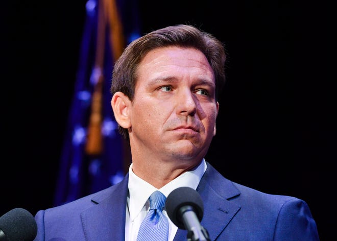 Florida's Republican incumbent Gov. Ron DeSantis and Charlie Crist, a former governor, take the stage at Sunrise Theatre for their only scheduled debate, Monday, Oct. 24, 2022, in Fort Pierce.